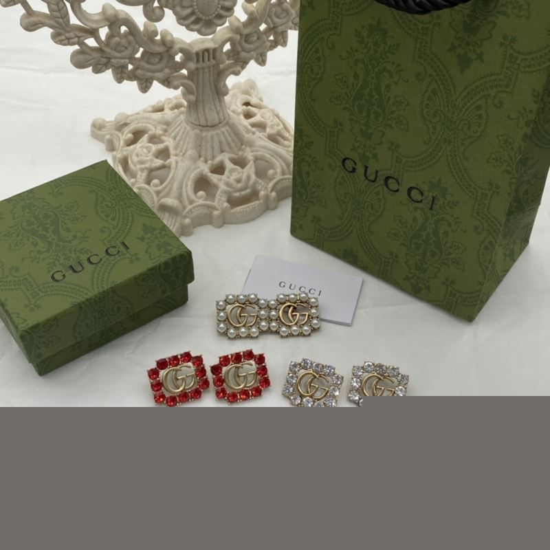 G*u*i earrings